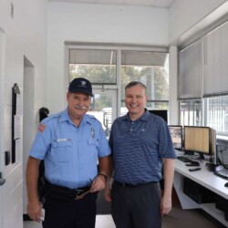 President Nat Carmack presents appreciation token to BOS Security Officer Lee O'Dillon. President Nat Carmack and Officer Lee O'Dillon