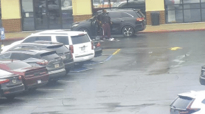 The suspect is seen standing outside of his vehicle, presumably looking for a gun as he indicated to other gym members. The suspect is seen standing outside of his vehicle, presumably looking for a gun as he indicated to other gym members.