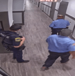 Two BOS Security Officers lead a local police officer to the injured male's apartment.