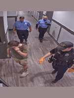 The two BOS Security Officers and local police officer lead the injured male out of his apartment and out of the building.