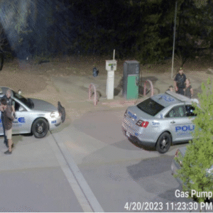The male suspect is handcuffed and put in a police vehicle. The male suspect is handcuffed and put in a police vehicle.