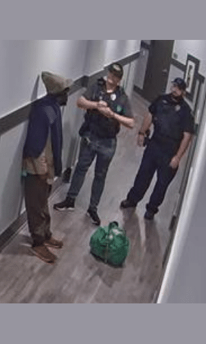 Officers question trespasser after being caught by proactive monitoring.