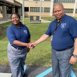 Site Supervisor at RCCTO Carl Howard presents token of appreciation to Officer Quintina Burnett. Officer Quintina Burnett and Site Supervisor Carl Howard