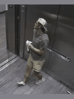 The injured male is standing in the elevator holding his right shoe. He is bleeding from his face and legs, and appears to be bruised on his right leg and unable to put weight on it.