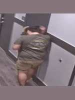 The injured male attempts to walk to his apartment, almost falling several times along the way.