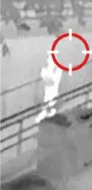 A trespasser enters the park from an entrance ramp. The image is captured in night vision and the trespasser was noticed by Artificial Intelligence technology detecting movement.