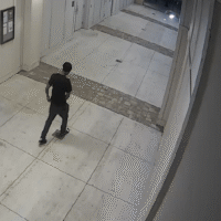An unknown man enters the private parking deck of a student apartment complex. An unknown man enters the private parking deck of a student apartment complex.